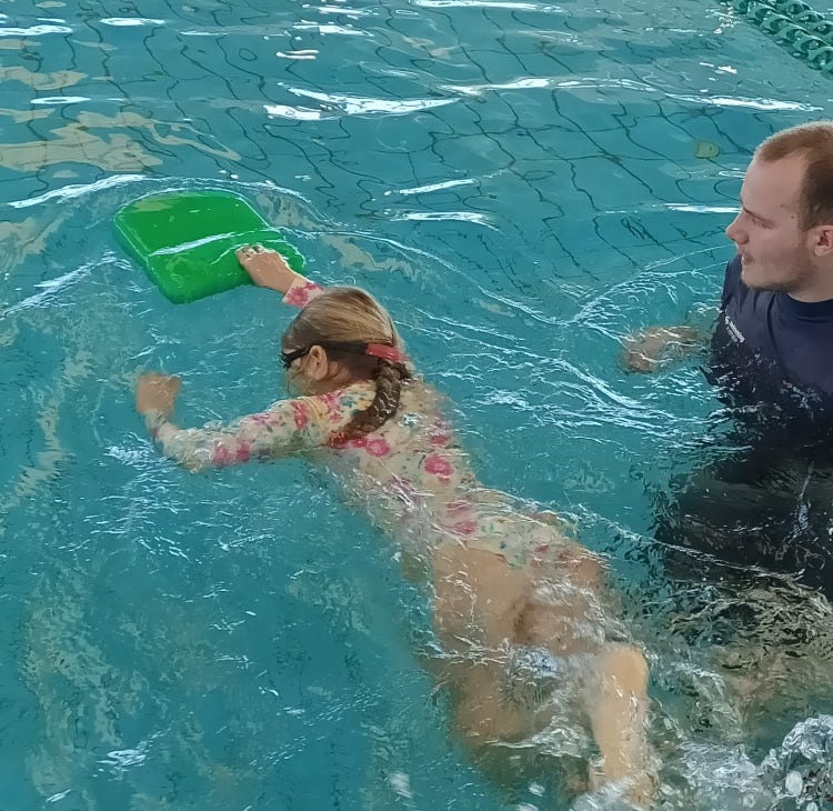 A student swimming during a swimming lesson